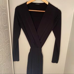 One piece long sleeve black jumpsuit with wide leg bottoms